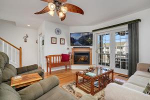 a living room with a couch and a fireplace at Charlie's Bayside Retreat - Pet friendly, In town! in Chincoteague