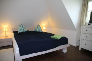 Ein Bett oder Betten in einem Zimmer der Unterkunft Villa Sorgenfrei - a65549