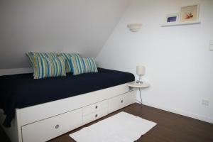 Ein Bett oder Betten in einem Zimmer der Unterkunft Villa Sorgenfrei - a65549