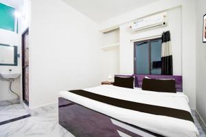 Ένα ή περισσότερα κρεβάτια σε δωμάτιο στο Hotel O The Light Hotel