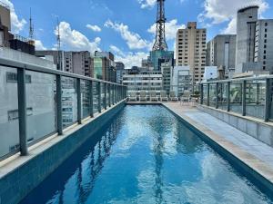 a swimming pool on the roof of a building at Edição Jardim Paulista in Sao Paulo