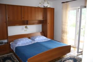 Postel nebo postele na pokoji v ubytování Apartments Sandra