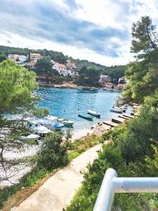 a body of water with boats in it at Apartmani Ferri 1 in Vrbanj +4 photos