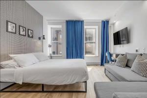 Katil atau katil-katil dalam bilik di Initial / Icone / Quebec+stat