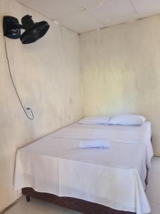 Ένα ή περισσότερα κρεβάτια σε δωμάτιο στο Quarto casal ventilador