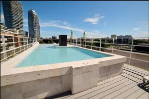 a swimming pool on the roof of a building at Crucero Puerto in Buenos Aires