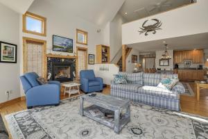 a living room with a couch and chairs and a fireplace at Egret's Cove - Pet friendly w/ Hot tub! in Deep Hole