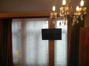 TV a/nebo společenská místnost v ubytování Carrera Grande Apartment