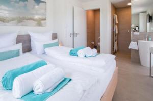 Ένα ή περισσότερα κρεβάτια σε δωμάτιο στο Ferienhaus 018 Fiete in Burhave