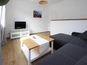 a living room with a couch and a table at Reihenhaus in Malchow in Malchow