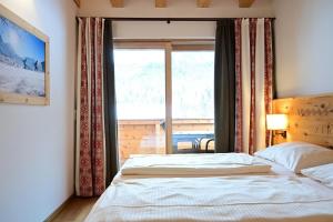 Posteľ alebo postele v izbe v ubytovaní Apartment Grünstein