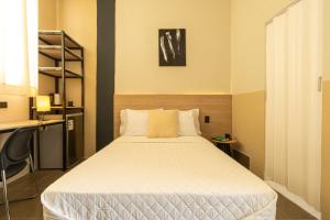 a bedroom with a large bed in a room at Soleil Suites in Iquitos