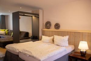 Postel nebo postele na pokoji v ubytování Hof Timmermann - Alte Werkstatt