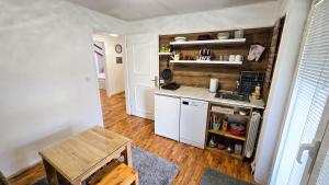a small kitchen with a stove and a sink at Holiday Home Old Town in Sarajevo