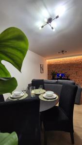 a dining room with a table and chairs at Apart Krakowska 41 - Stare Miasto - Old Town in Opole