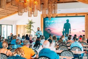 a crowd of people in a room with a presentation at Van der Valk Plaza Beach & Dive Resort Bonaire - ALL INCLUSIVE in Kralendijk +60 photos