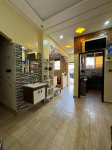 a large room with a kitchen with a counter at Magnifique chambre à prix inedit in Agadir