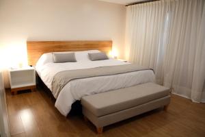 Chacras de Sierra tesisinde bir odada yatak veya yataklar