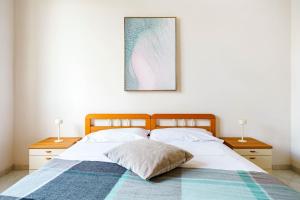 Postel nebo postele na pokoji v ubytování Oasi Kite - Stagnone Apartments