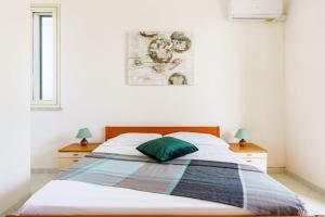 Postel nebo postele na pokoji v ubytování Oasi Kite - Stagnone Apartments