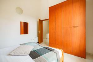 Postel nebo postele na pokoji v ubytování Oasi Kite - Stagnone Apartments