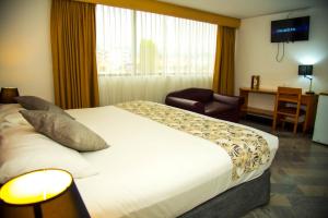 Postel nebo postele na pokoji v ubytování Hotel la Giralda