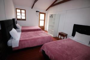 Postel nebo postele na pokoji v ubytování Hospedaje Apu San Isidro