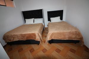 Postel nebo postele na pokoji v ubytování Hospedaje Apu San Isidro