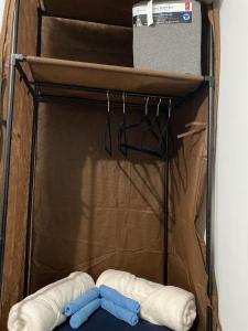 a cupboard with two gloves and a box at Casa de Descanso in Monterrey