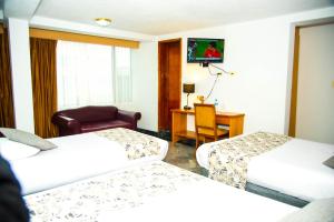 Postel nebo postele na pokoji v ubytování Hotel la Giralda
