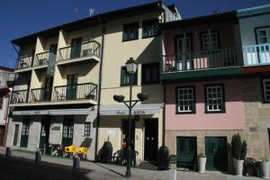 a large building with balconies on top of it at Hotel Katia in Chaves