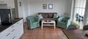 Posezení v ubytování Appartement Fördeblick am Strand von Wassersleben App 631