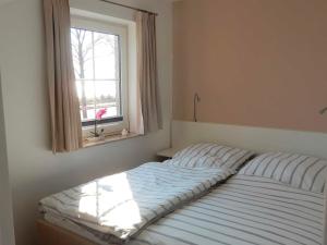 Postel nebo postele na pokoji v ubytování Appartement Fördeblick am Strand von Wassersleben App 631