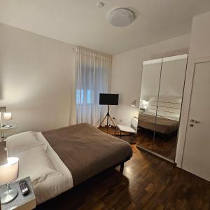 Postel nebo postele na pokoji v ubytování ROOM & PARKING in Centro Città con Parcheggio Privato e WIFI