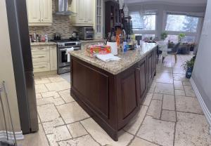 a kitchen with a large island in the middle at 4人双床房 in Mississauga +3 photos