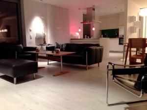 a living room with a couch and a table at Triton Suite in Eckernförde