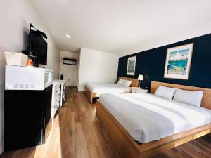 Rúm í herbergi á Cloud 9 Inn