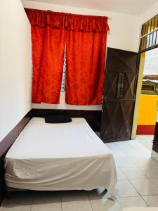 Postel nebo postele na pokoji v ubytování Gually Hostel
