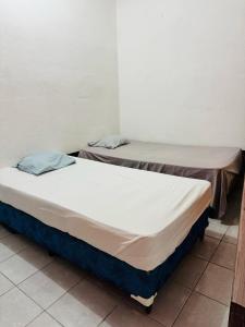Postel nebo postele na pokoji v ubytování Gually Hostel