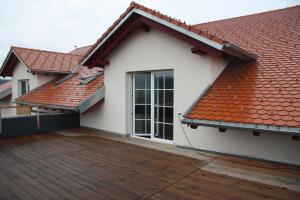 a white house with a red roof at Ferienwohnung Balkon in Bräunlingen