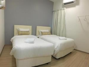Postel nebo postele na pokoji v ubytování Alami Garden Hotel