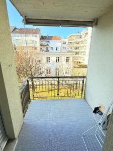 a balcony with a view of a building at Very nice flat 80 meter from SBB in Basel