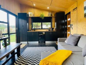 a living room with a couch and a table at The Sanctuary in Ohakune