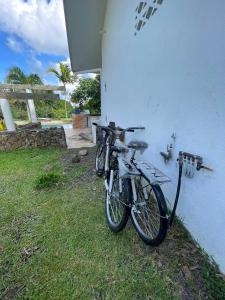 two bikes are parked next to a building at Bora Bora Fare Sophia in Bora Bora
