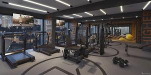 una palestra con diversi tapis roulant e macchinari per il cardio-fitness in una stanza di Studio Barra Carnaval a Salvador