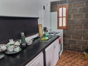 a kitchen with a sink and a counter top at Departamento cómodo in Concepción del Uruguay