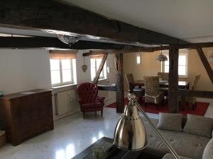 a living room with a couch and a table at Zweite Heimat Ferienwohnungen in Herdecke