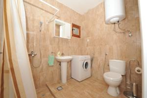 a bathroom with a toilet sink and a shower at Apartments Darija in Kotor