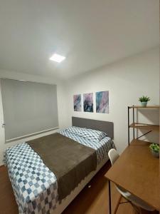 Postel nebo postele na pokoji v ubytování Apartamento Espaço Aruba