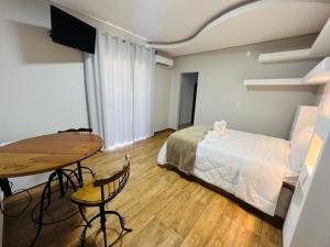 En eller flere senge i et værelse på Pousada Hilário ltda + 97 billeder